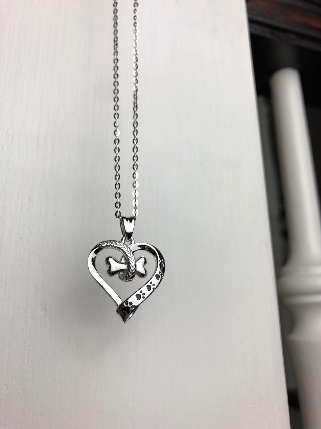 Stainless steel necklace with dog paw and heart
